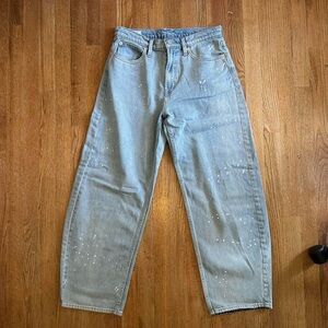 Light blue Gap barrel leg jeans with paint splatter details